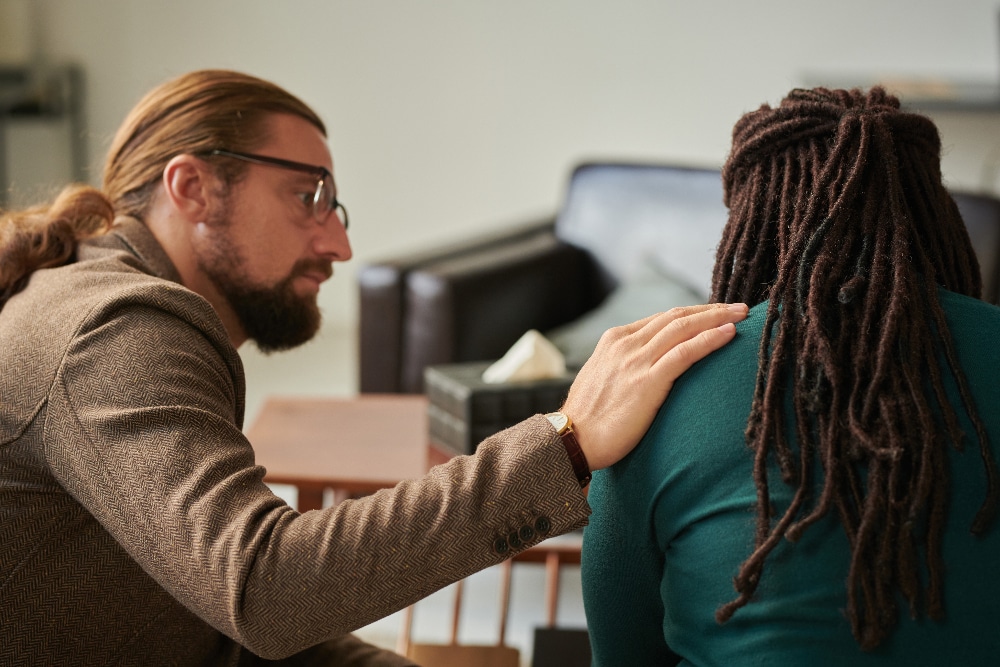 man speaking with therapist about ocd